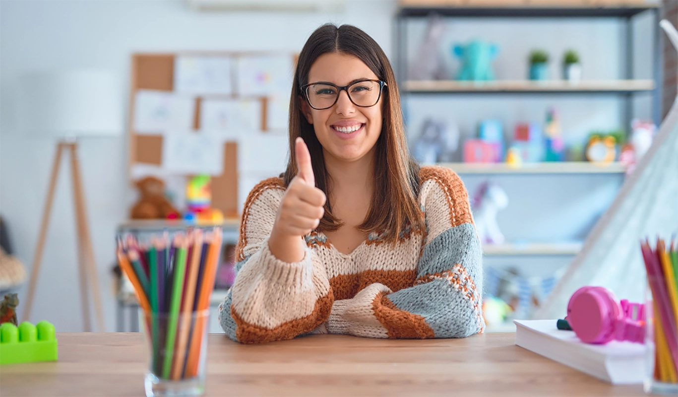 pleased young woman with thumbs up