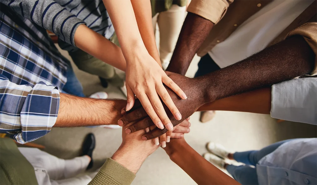 hands joined together in group