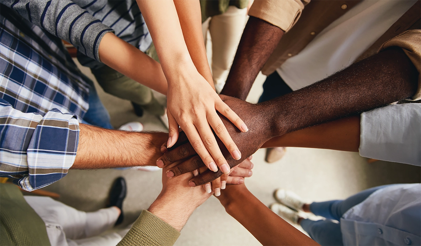 hands joined together in group