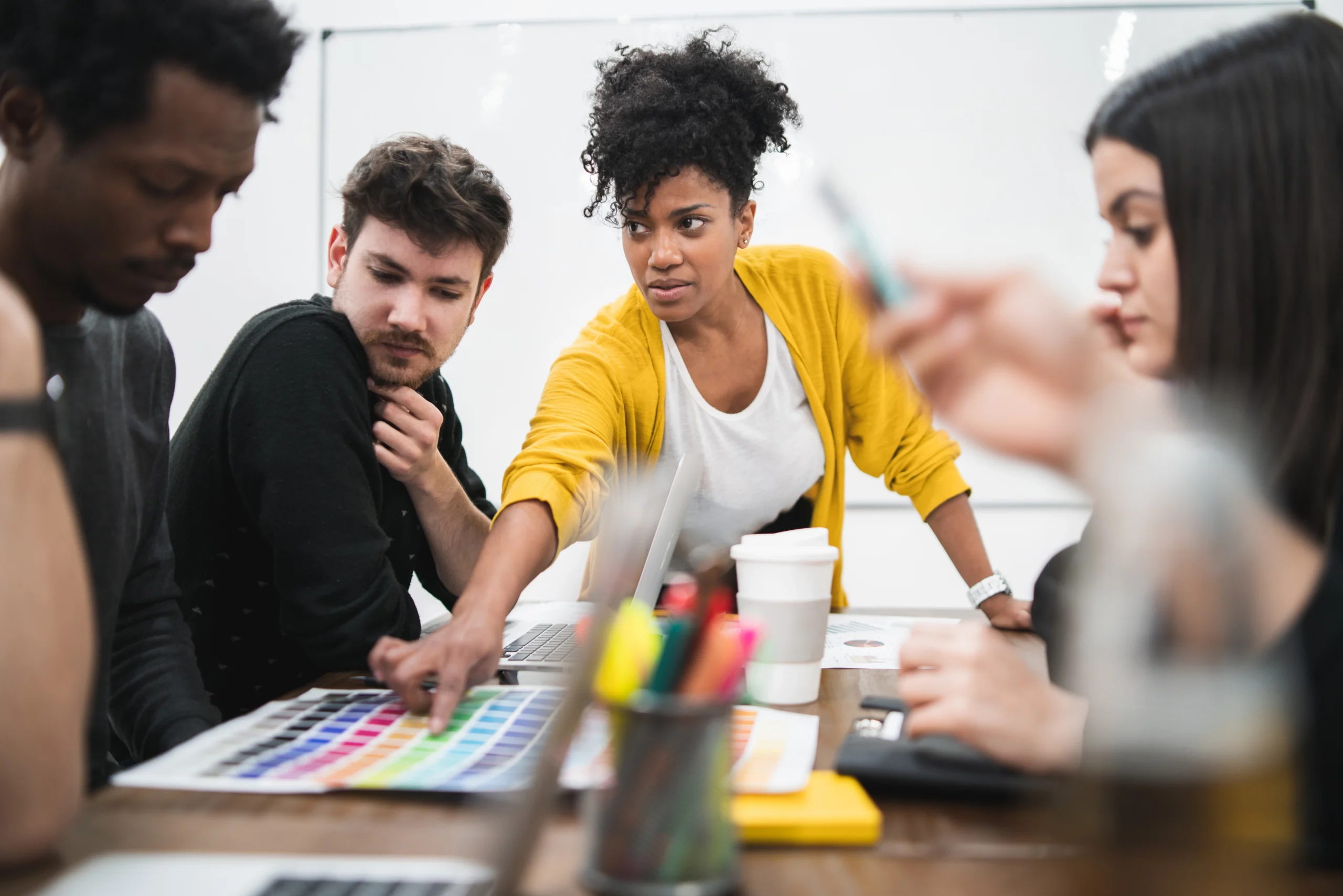 woman professional assisting young adults