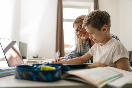 Mom and son doing homework together