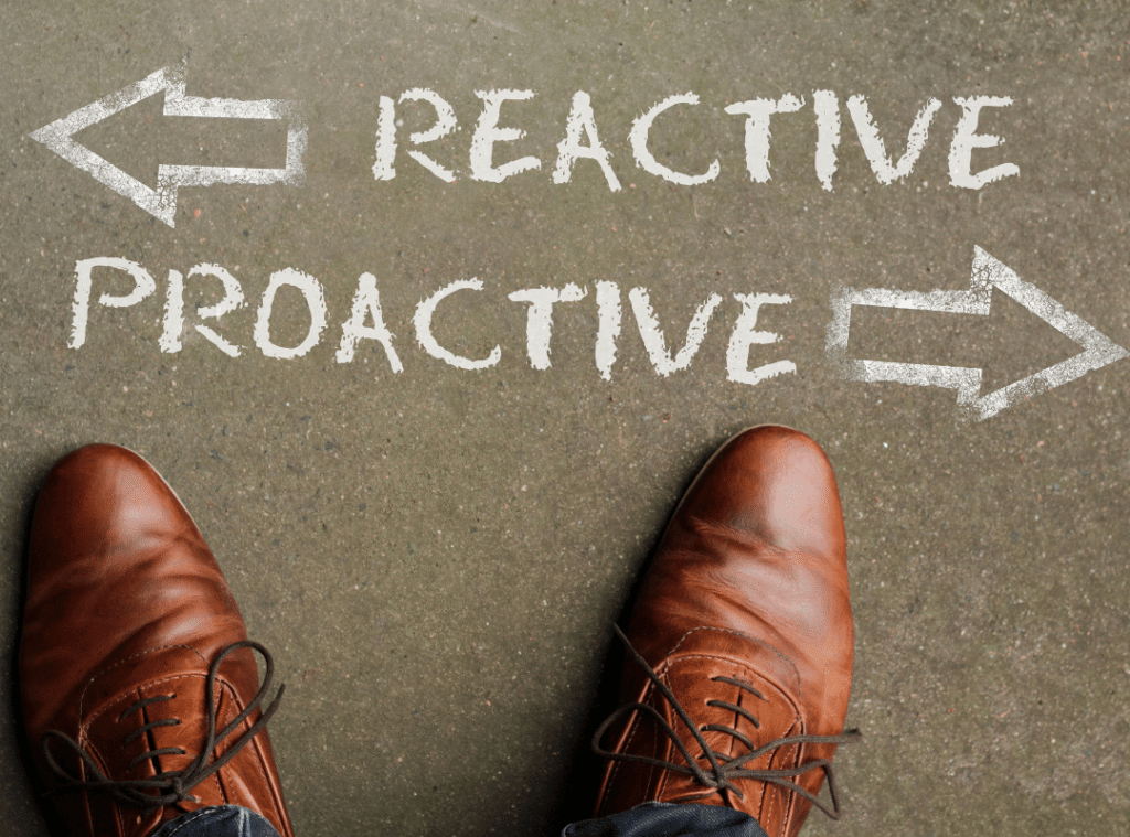 an view looking down on a pair of shoes with the word reactive and an arrow pointing left, and the word proactive with an arrow pointing to the right.
