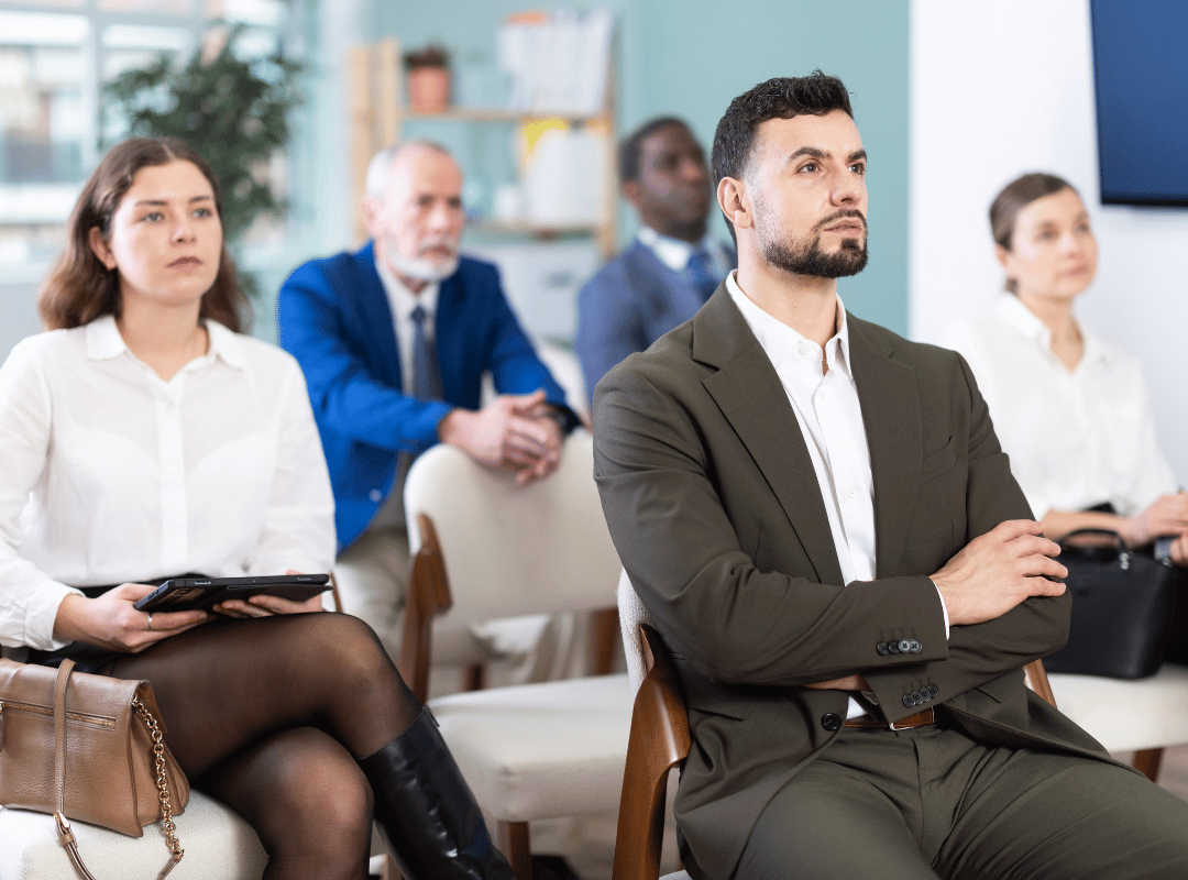 Class with adults looking bored